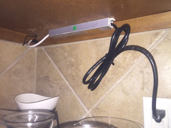 The LED driver mounted under the kitchen cabinets
